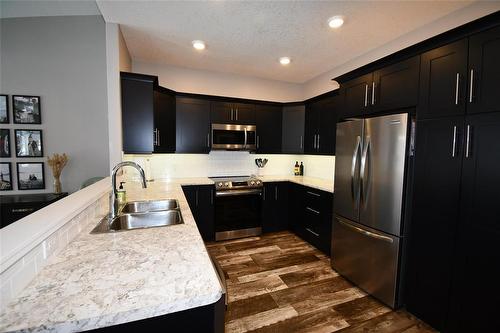 302 Clement Drive, Russell, MB - Indoor Photo Showing Kitchen With Double Sink With Upgraded Kitchen