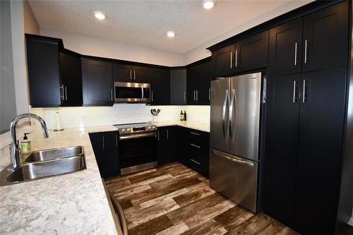 302 Clement Drive, Russell, MB - Indoor Photo Showing Kitchen With Double Sink With Upgraded Kitchen