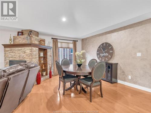 18 Shawnee Court, Leamington, ON - Indoor Photo Showing Dining Room With Fireplace