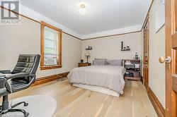 Bedroom featuring light hardwood / wood-style floors and cooling unit - 