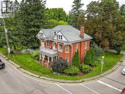 View of front facade with a balcony and a front yard - 