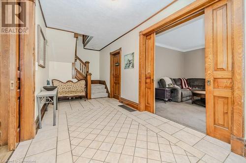 Hall featuring light colored carpet and crown molding - 3212 Roseville Road, Roseville, ON - Indoor Photo Showing Other Room