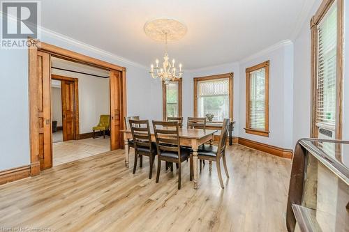 Dining space featuring light hardwood / wood-style flooring, crown molding, and a notable chandelier - 3212 Roseville Road, Roseville, ON - Indoor Photo Showing Dining Room