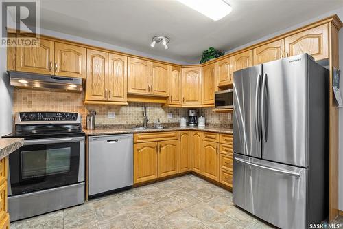 208 2305 Adelaide Street E, Saskatoon, SK - Indoor Photo Showing Kitchen With Double Sink