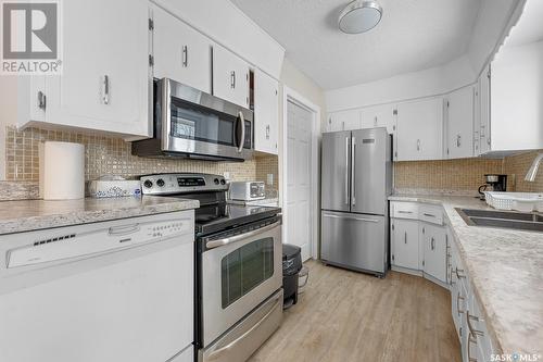 35 Hawkes Avenue, Regina, SK - Indoor Photo Showing Kitchen With Double Sink