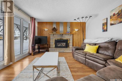 35 Hawkes Avenue, Regina, SK - Indoor Photo Showing Living Room With Fireplace