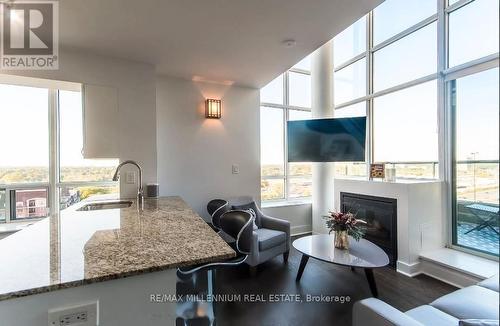 827 - 250 Manitoba Street, Toronto, ON - Indoor Photo Showing Living Room With Fireplace