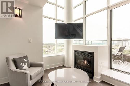 827 - 250 Manitoba Street, Toronto, ON - Indoor Photo Showing Living Room With Fireplace