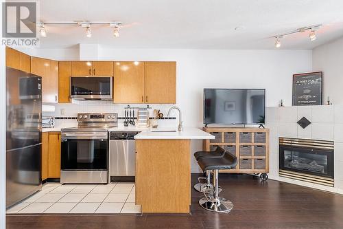 1710 939 Homer Street, Vancouver, BC - Indoor Photo Showing Kitchen With Fireplace