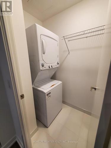 1220 - 20 Edward Street, Toronto, ON - Indoor Photo Showing Laundry Room