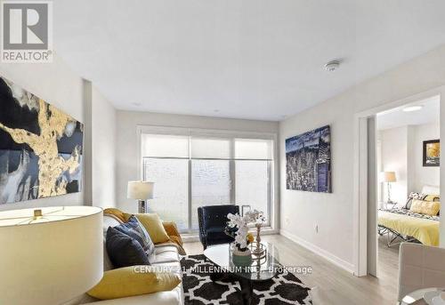 108 - 3686 St Clair Avenue E, Toronto, ON - Indoor Photo Showing Living Room