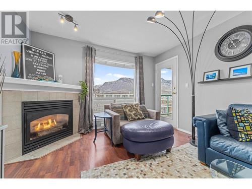 Cozy fireplace to cuddle up next to! - 683 Victoria Street Unit# 308, Kamloops, BC - Indoor Photo Showing Living Room With Fireplace