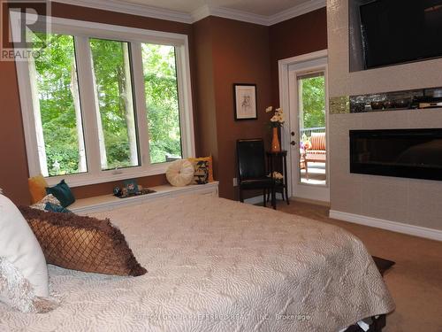 138 Eastview Avenue, Woodstock (Woodstock - North), ON - Indoor Photo Showing Bedroom With Fireplace