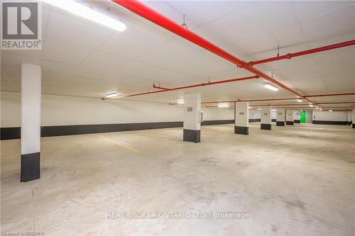 115 - 1565 Rose Way, Milton, ON - Indoor Photo Showing Garage