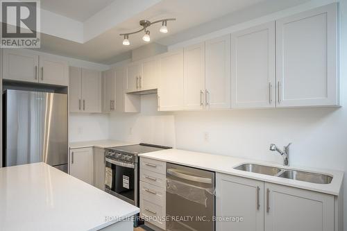 119 - 1070 Douglas Mccurdy Comm, Mississauga, ON - Indoor Photo Showing Kitchen With Stainless Steel Kitchen With Double Sink