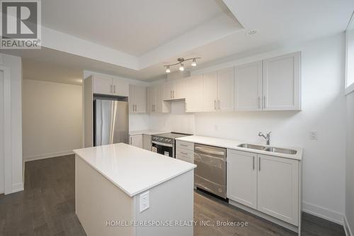 119 - 1070 Douglas Mccurdy Comm, Mississauga, ON - Indoor Photo Showing Kitchen With Stainless Steel Kitchen With Double Sink