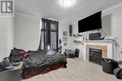 94 Stanley Street, London, ON - Indoor Photo Showing Bedroom With Fireplace