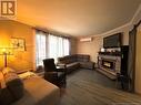 9 King Street, Campbellton, NB  - Indoor Photo Showing Living Room With Fireplace 