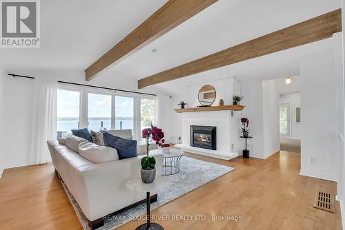 7494 Bamsey Drive, Hamilton Township, ON - Indoor Photo Showing Living Room With Fireplace