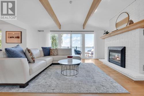 7494 Bamsey Drive, Hamilton Township, ON - Indoor Photo Showing Living Room With Fireplace