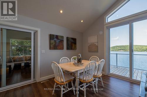 1744 Papineau Lake Road, Hastings Highlands, ON - Indoor Photo Showing Dining Room With Body Of Water