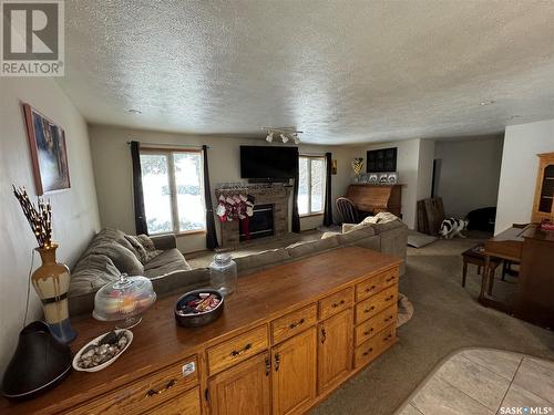 Acreage Near White Cap, Lomond Rm No. 37, SK - Indoor Photo Showing Living Room With Fireplace