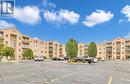 310 Village Grove Unit# 210B, Tecumseh, ON  - Outdoor With Balcony With Facade 