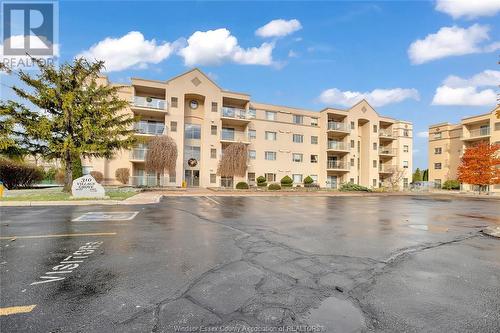 310 Village Grove Unit# 210B, Tecumseh, ON - Outdoor With Balcony With Facade