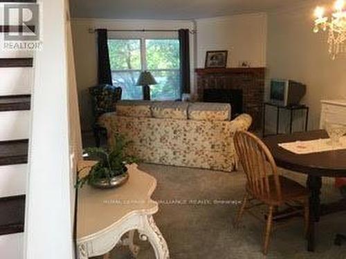 13 Portneuf Court, Toronto (Waterfront Communities), ON - Indoor Photo Showing Dining Room With Fireplace