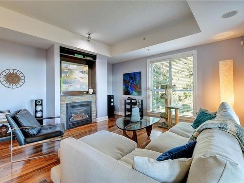 701-1400 Lynburne Pl, Langford, BC - Indoor Photo Showing Living Room With Fireplace