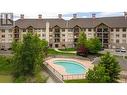 2551 Shoreline Drive Unit# 413, Lake Country, BC  - Outdoor With In Ground Pool With Facade 