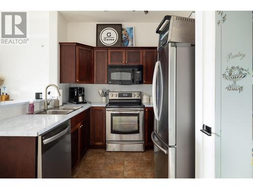 2551 Shoreline Drive Unit# 413, Lake Country, BC - Indoor Photo Showing Kitchen With Double Sink