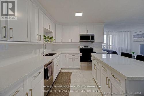 1404 - 100 Wingarden Court, Toronto, ON - Indoor Photo Showing Kitchen With Double Sink