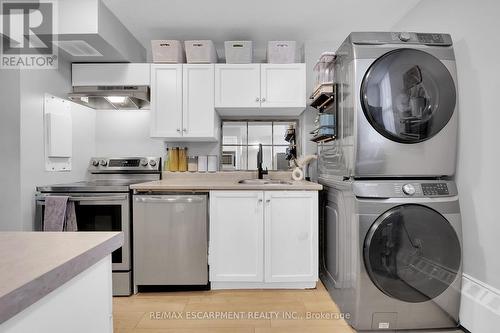 215 - 350 Quigley Road, Hamilton, ON - Indoor Photo Showing Laundry Room