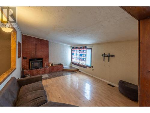 715 9Th Street S, Golden, BC - Indoor Photo Showing Other Room With Fireplace