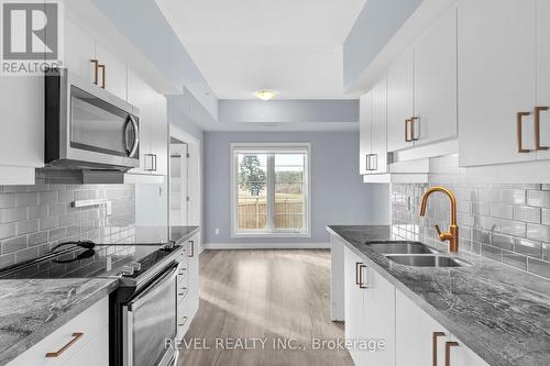 117 - 54 Koda Street, Barrie, ON - Indoor Photo Showing Kitchen With Double Sink With Upgraded Kitchen