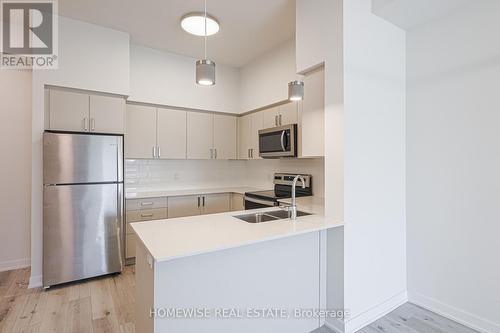 210 - 1475 Whites Road, Pickering, ON - Indoor Photo Showing Kitchen With Stainless Steel Kitchen With Double Sink