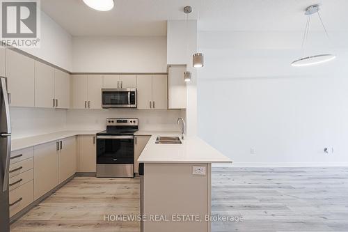 210 - 1475 Whites Road, Pickering, ON - Indoor Photo Showing Kitchen With Stainless Steel Kitchen With Double Sink