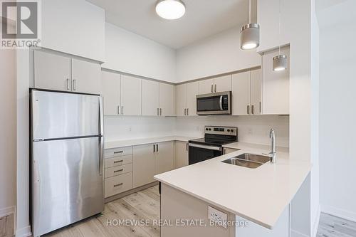 210 - 1475 Whites Road, Pickering, ON - Indoor Photo Showing Kitchen With Stainless Steel Kitchen With Double Sink With Upgraded Kitchen