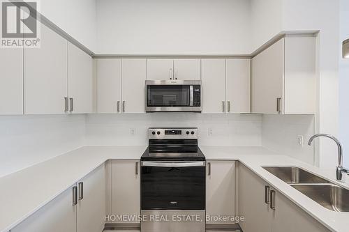 210 - 1475 Whites Road, Pickering, ON - Indoor Photo Showing Kitchen With Double Sink