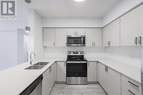 304 - 1475 Whites Road, Pickering, ON - Indoor Photo Showing Kitchen With Stainless Steel Kitchen With Double Sink