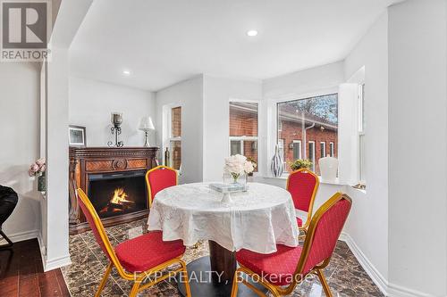 8411 Russell Road, Ottawa, ON - Indoor Photo Showing Dining Room With Fireplace