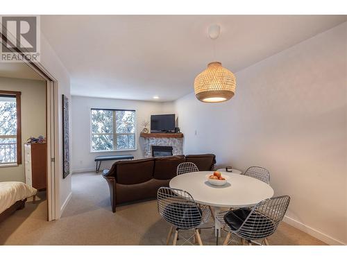 9812 Silver Star Road Unit# 312, Vernon, BC - Indoor Photo Showing Dining Room With Fireplace