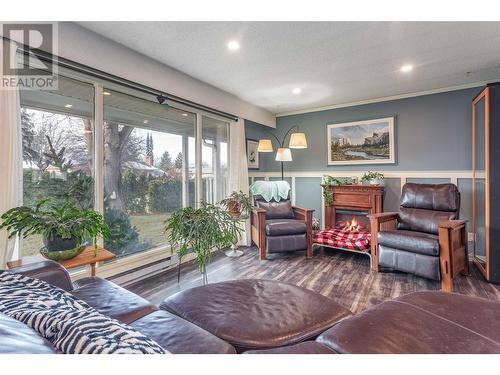 Main living area - 235 Gibbs Road W, Kelowna, BC - Indoor Photo Showing Living Room With Fireplace