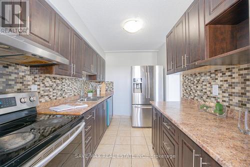 322 - 1050 Stainton Drive, Mississauga, ON - Indoor Photo Showing Kitchen With Double Sink With Upgraded Kitchen