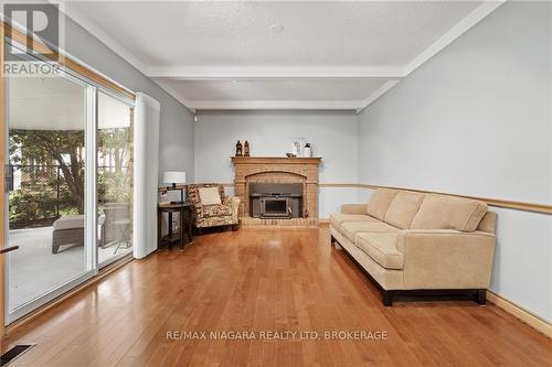 6 Butler Crescent, St. Catharines, ON - Indoor Photo Showing Living Room With Fireplace