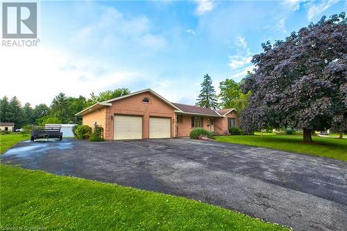 View of front facade featuring a garage and a front yard - 3 Maitland Street, Blandford, ON - Outdoor