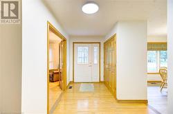 Entryway with light hardwood / wood-style flooring - 