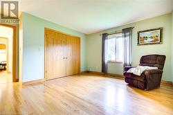 Sitting room featuring light wood-type flooring - 