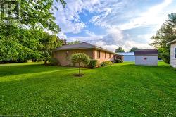 View of yard featuring a storage unit - 